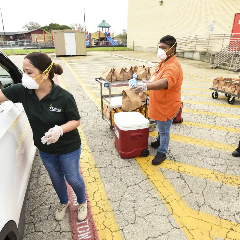 Volunteers deliver food to hungry kids during coronavirus-related school closures.